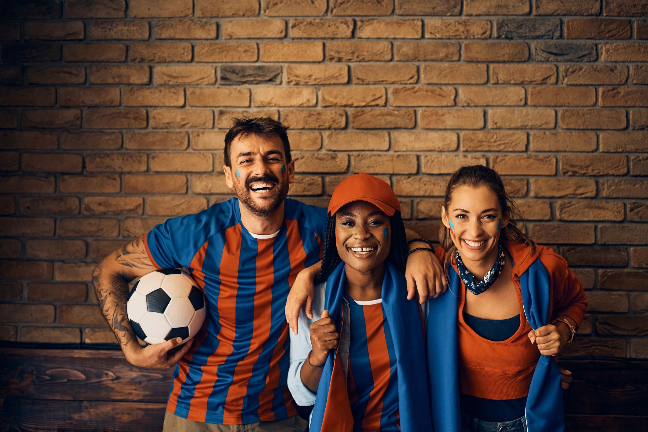 Football supporters smiling together